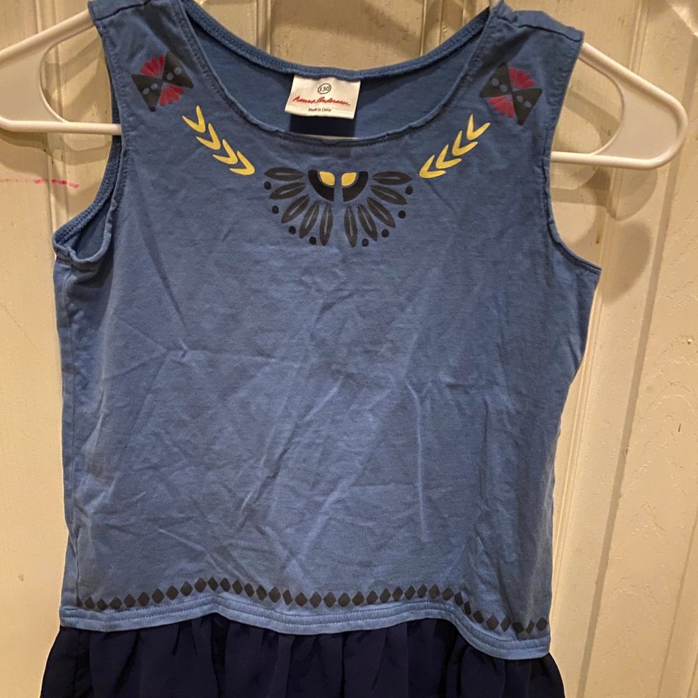 Cute sleeveless blue top with frill at hem